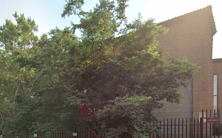 A building with trees in front of it